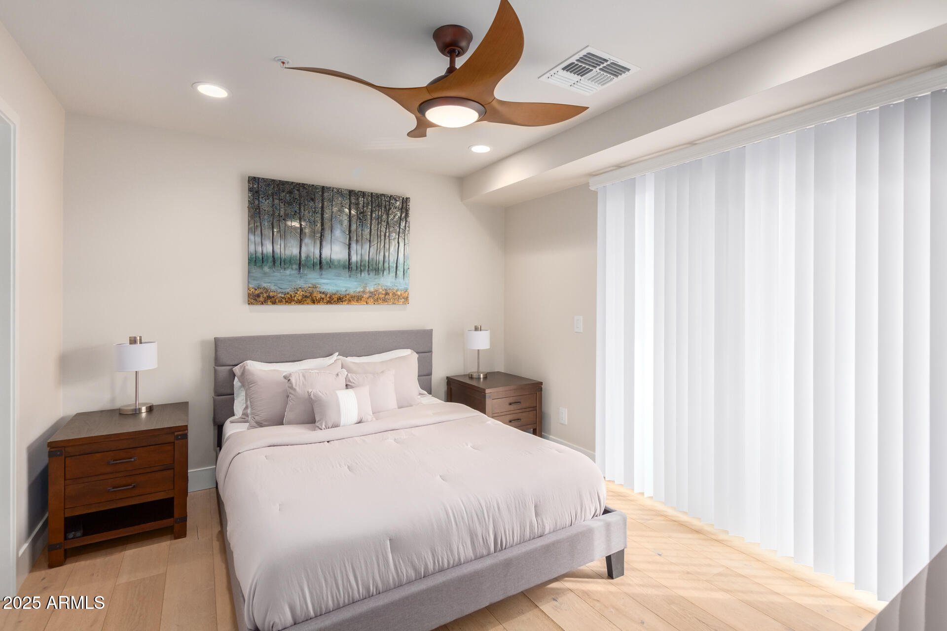 7550 East Osborn Road, Unit 1002 Scottsdale, AZ 85251 - Photo 8 of 23 a bedroom with a bed and a painting