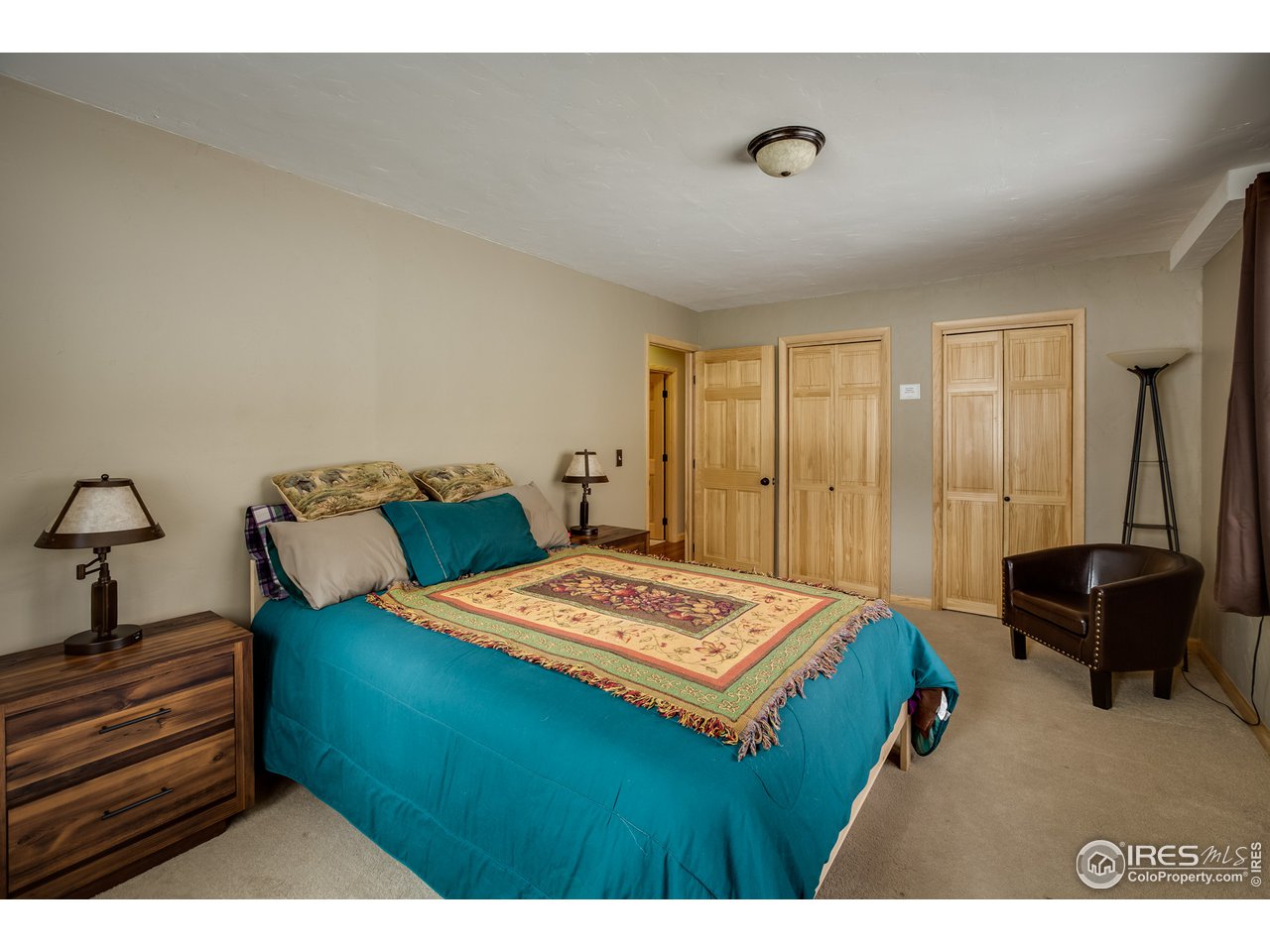 7172 Olde Stage Road Boulder, CO 80302 - Photo 21 of 35 a bedroom with a bed and a table in it