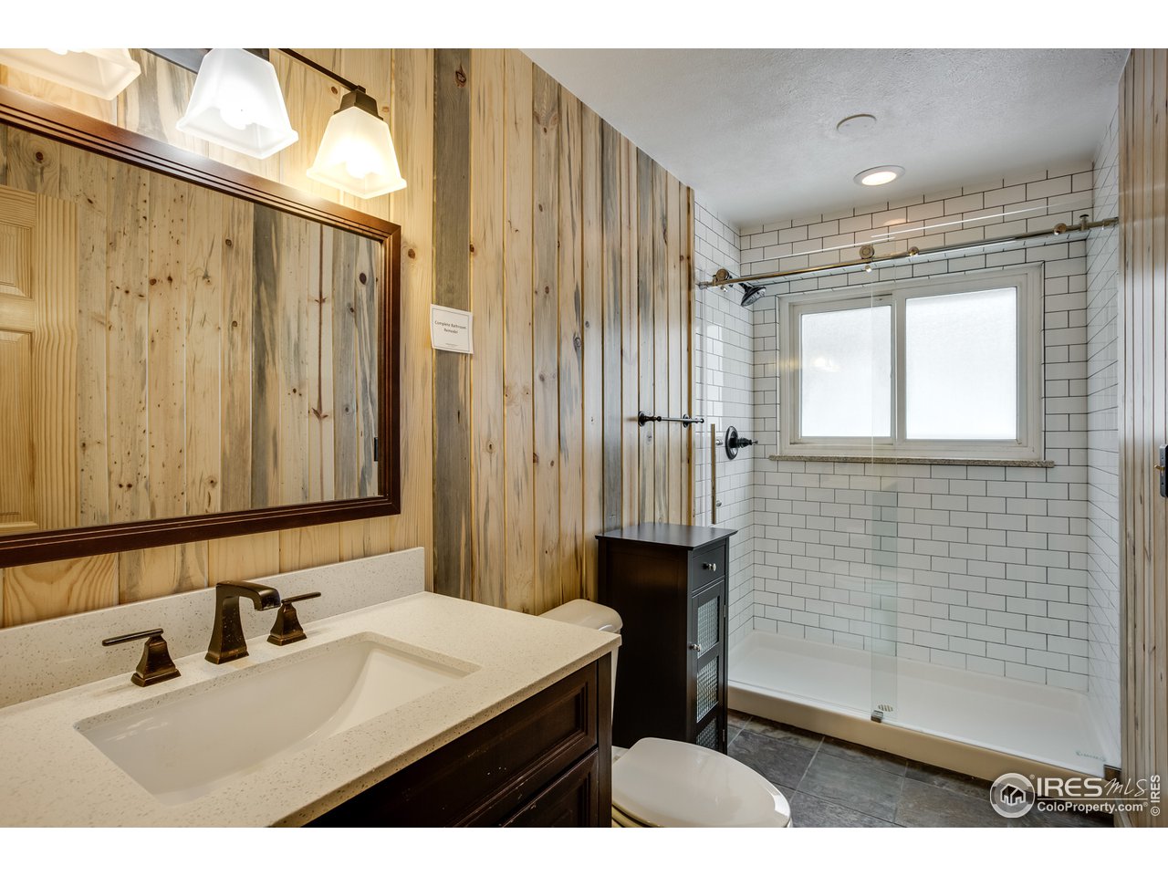 7172 Olde Stage Road Boulder, CO 80302 - Photo 24 of 35 a bathroom with a sink a toilet and shower