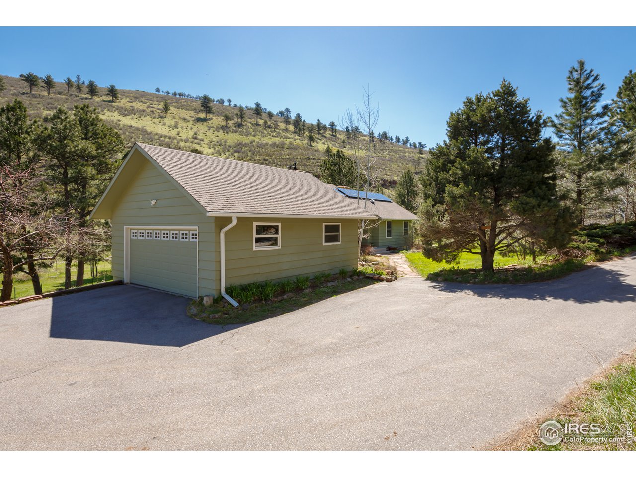 7172 Olde Stage Road Boulder, CO 80302 - Photo 27 of 35 a view of a house with a yard