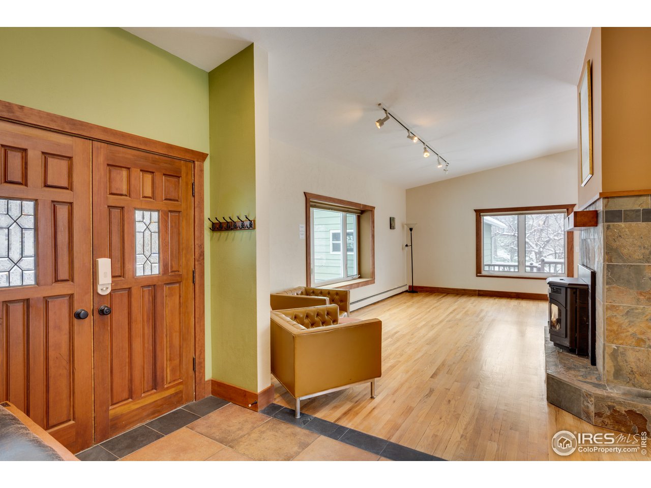 7172 Olde Stage Road Boulder, CO 80302 - Photo 5 of 35 a living room with furniture and a flat screen tv