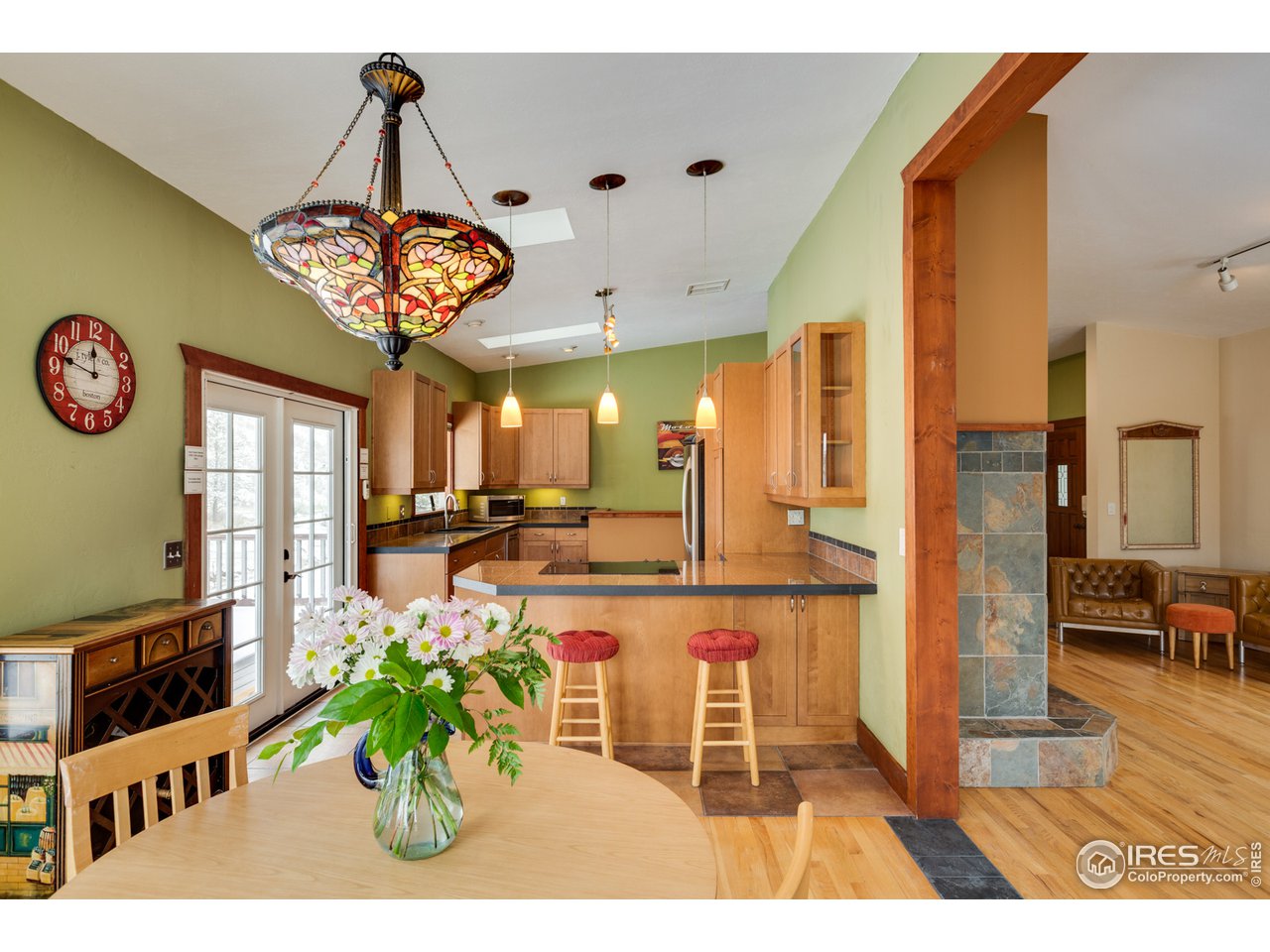 7172 Olde Stage Road Boulder, CO 80302 - Photo 7 of 35 a view of a dining hall with a dining table and chairs
