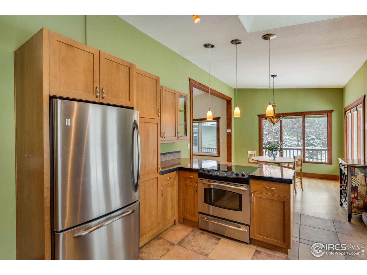 7172 Olde Stage Road Boulder, CO 80302 - Photo 8 of 35 a kitchen with stainless steel appliances a refrigerator and a stove