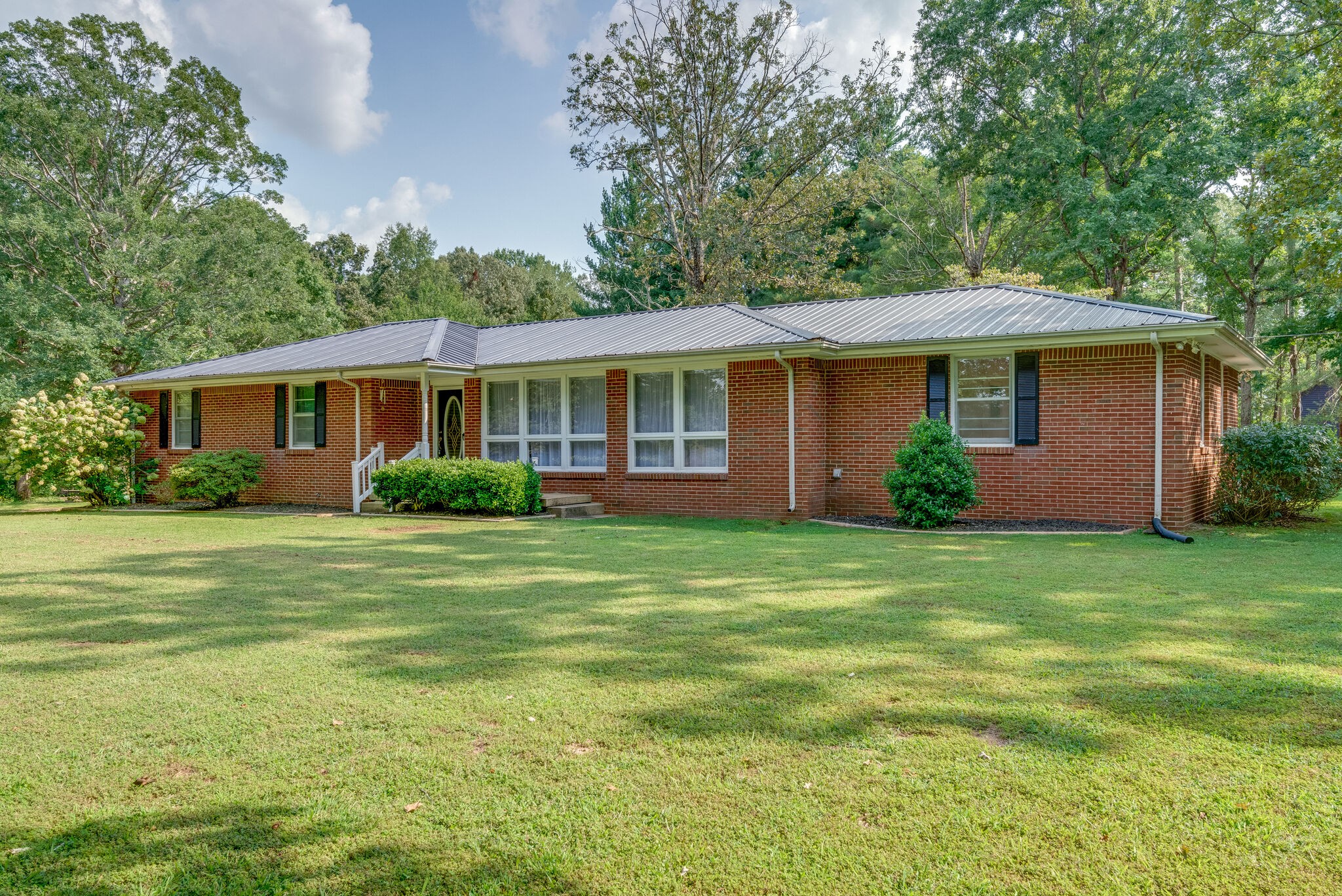 101 Duke Road Dickson, TN 37055 - Photo 2 of 30 a front view of a house with a garden