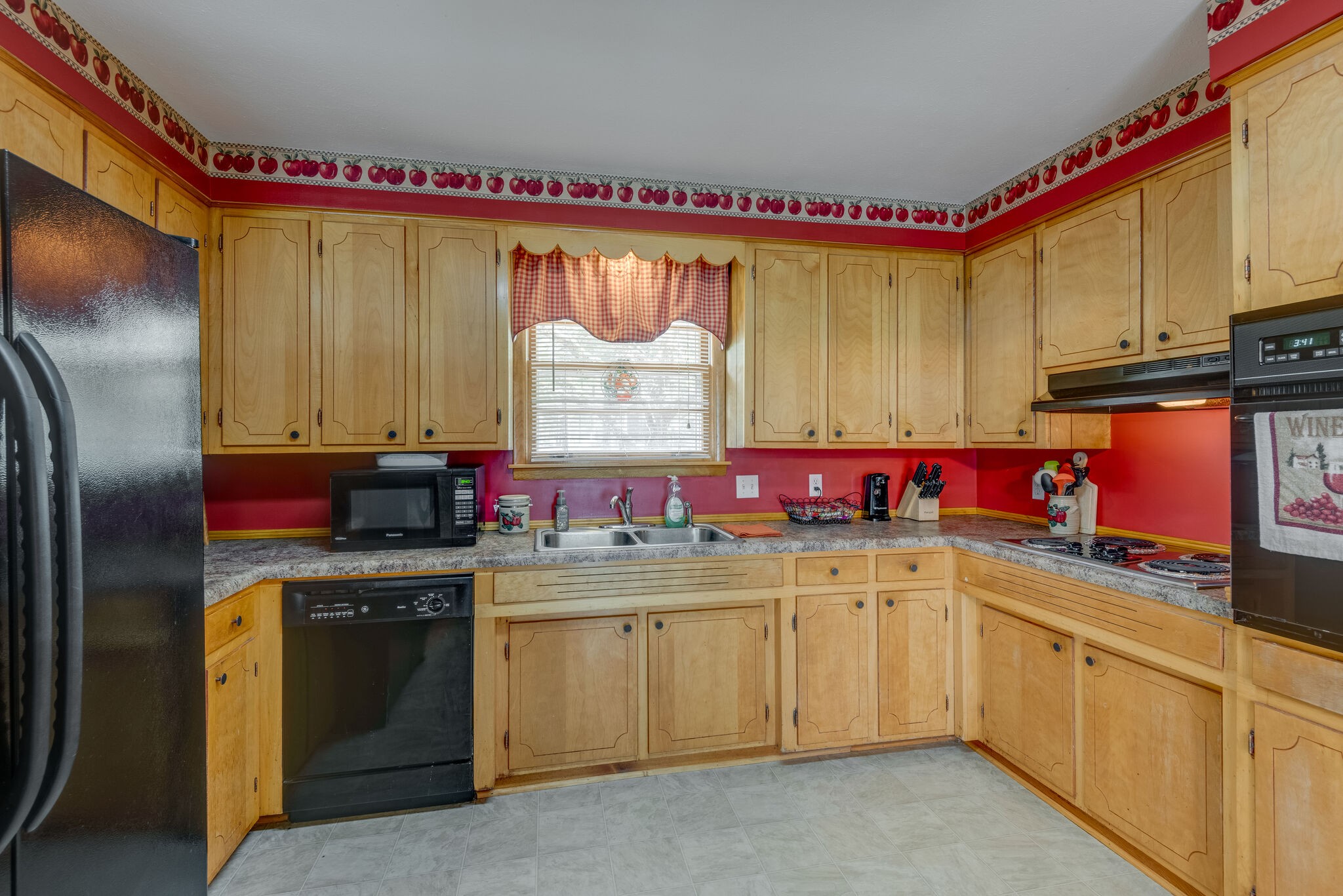 101 Duke Road Dickson, TN 37055 - Photo 10 of 30 a kitchen with a sink dishwasher window and cabinets