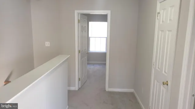 a bathroom with a tub and toilet