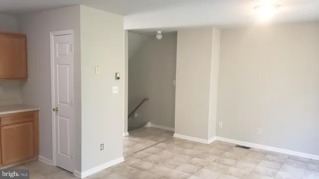 a view of a hallway with closet and bathroom