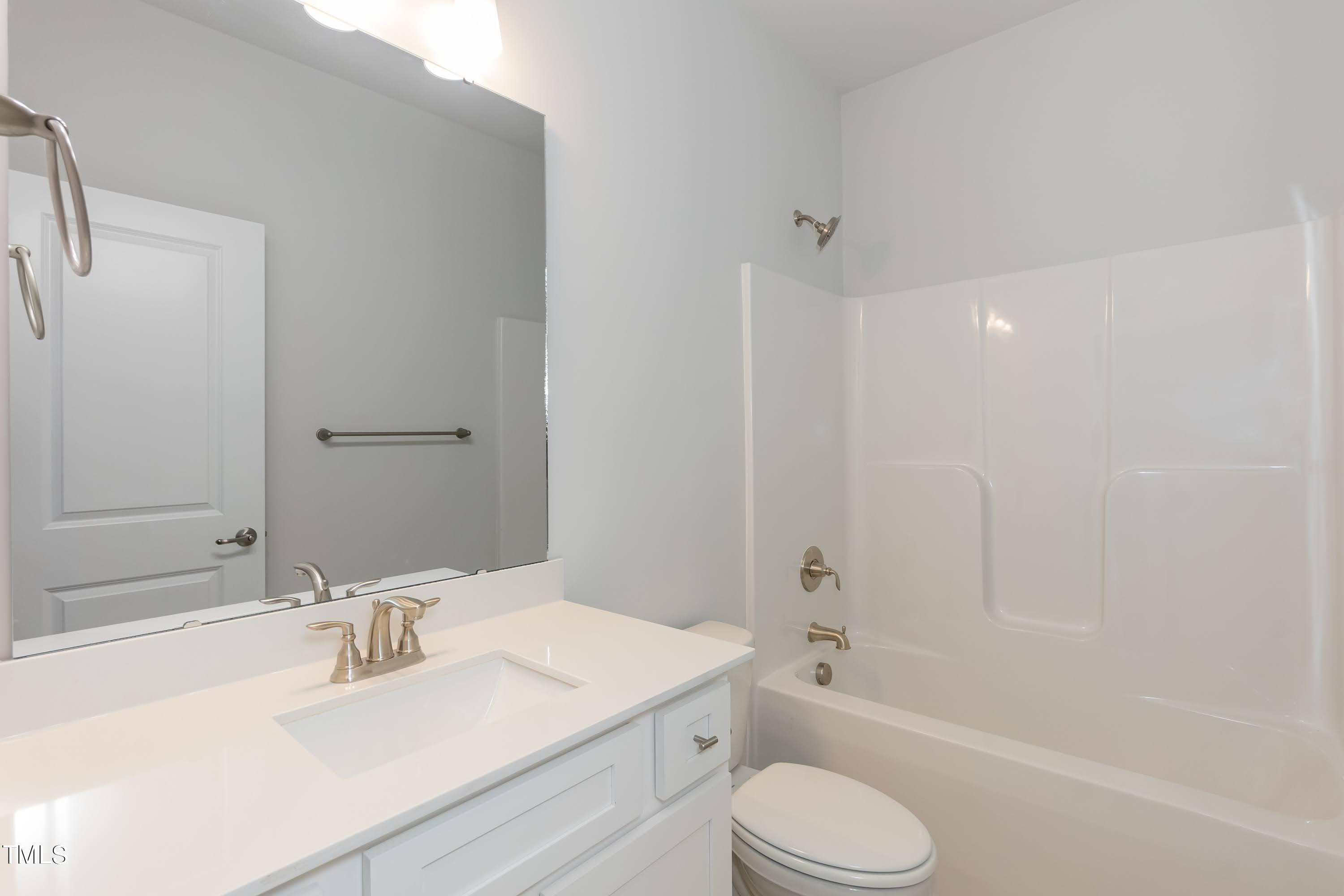67 Decatur Drive Fuquay-Varina, NC 27526 - Photo 25 of 35 a bathroom with a sink toilet tub and shower