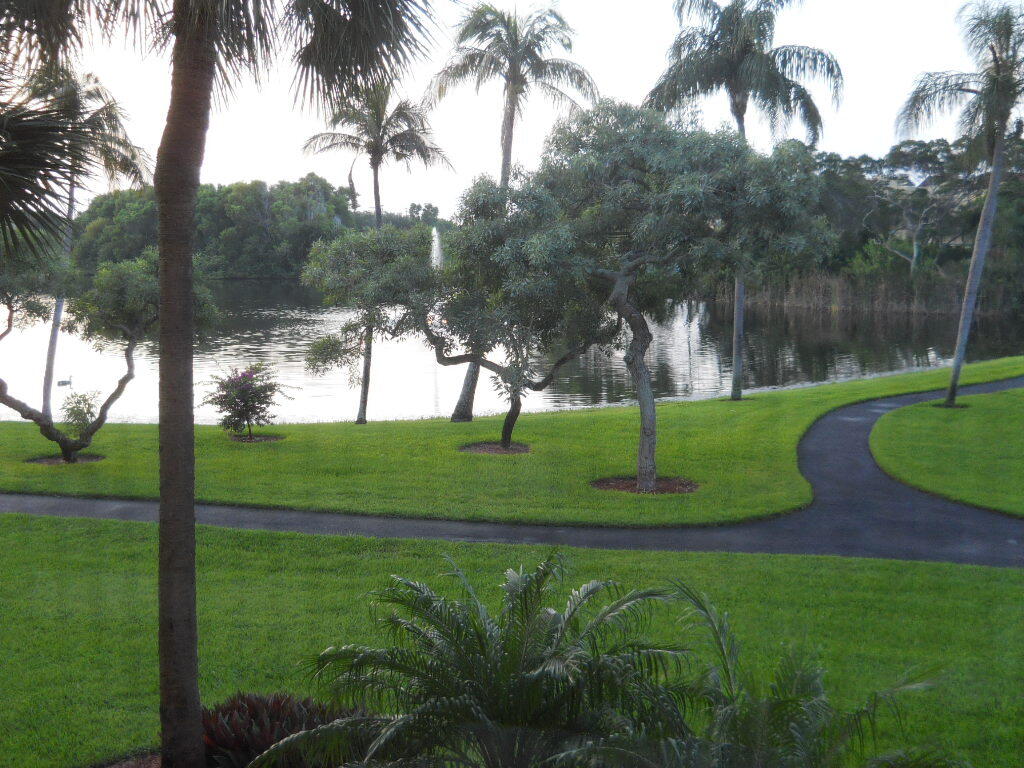1915 Lavers Circle, Unit E206 Delray Beach, FL 33444 - Photo 9 of 17 patio 2nd view of lake and pool