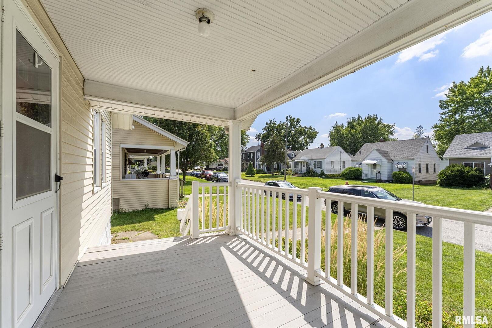 1904 30th Street Moline, IL 61265 - Photo 2 of 13 a view of a house with porch and wooden floor
