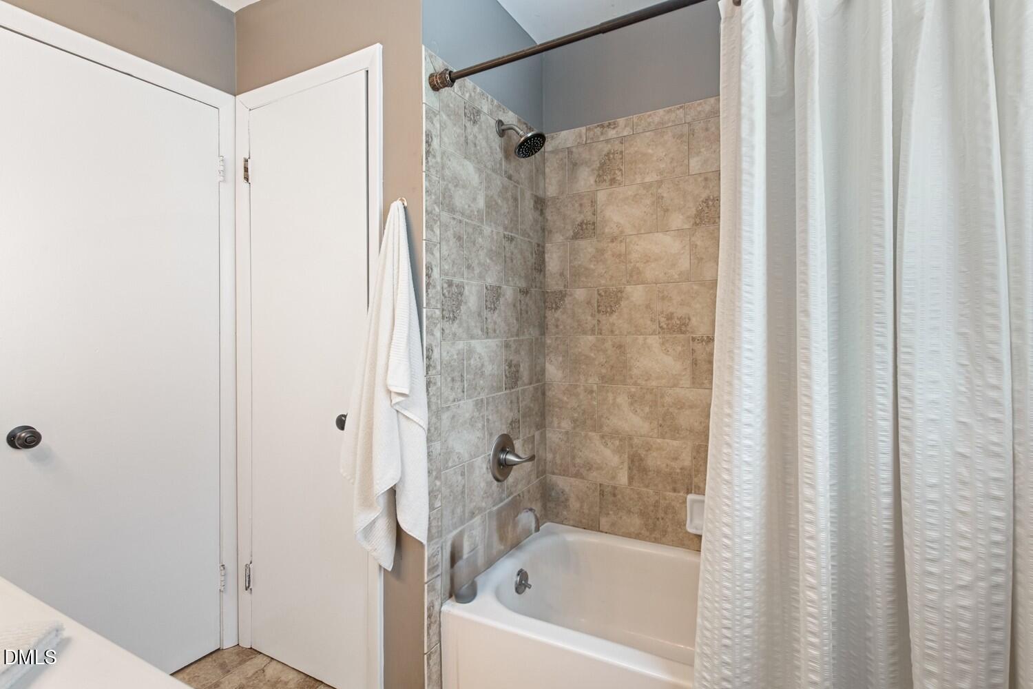 134 Longview Road Madison, NC 27025 - Photo 38 of 49 a bathroom with a shower and a bath tub
