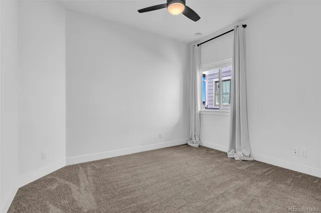 an empty room with fan