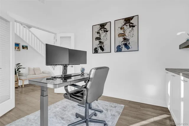 a workspace with furniture and wooden floor