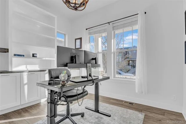 a workspace with furniture and a window