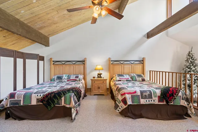 a bedroom with bed and a window