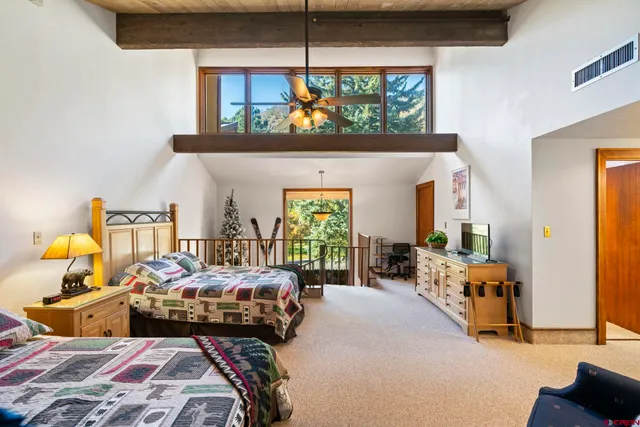 a bedroom with bed and a window