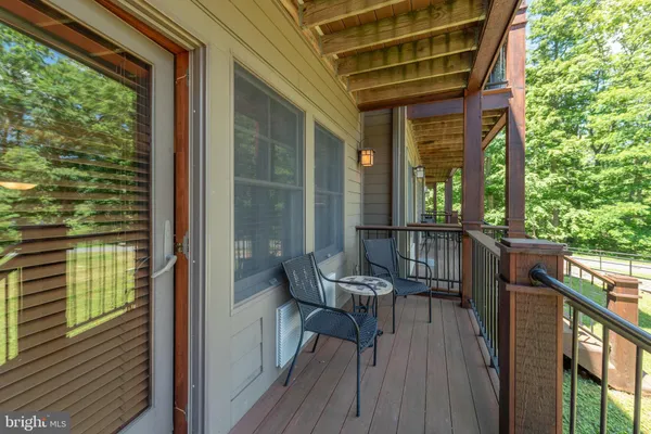 a view of a balcony with chairs