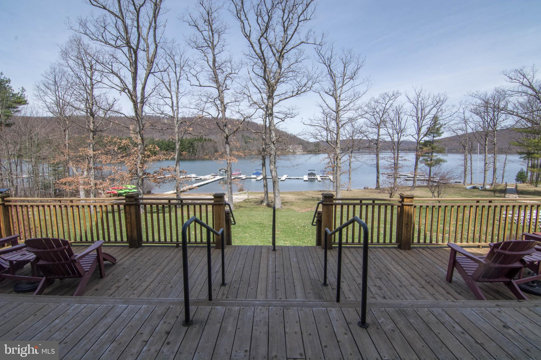 565 Glendale Road, Unit 103B Oakland, MD 21550 - Photo 40 of 53 a view of a deck with furniture and wooden floor