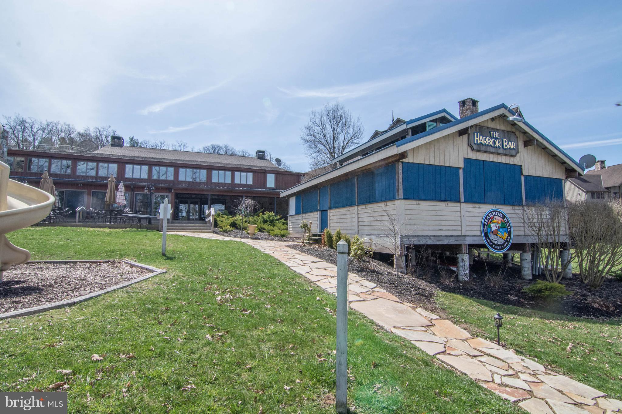 565 Glendale Road, Unit 103B Oakland, MD 21550 - Photo 44 of 53 a view of a house with a yard and furniture