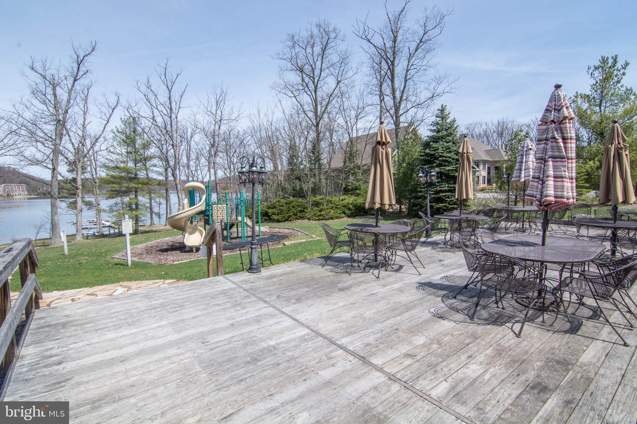 565 Glendale Road, Unit 103B Oakland, MD 21550 - Photo 45 of 53 a view of a park with bench and trees