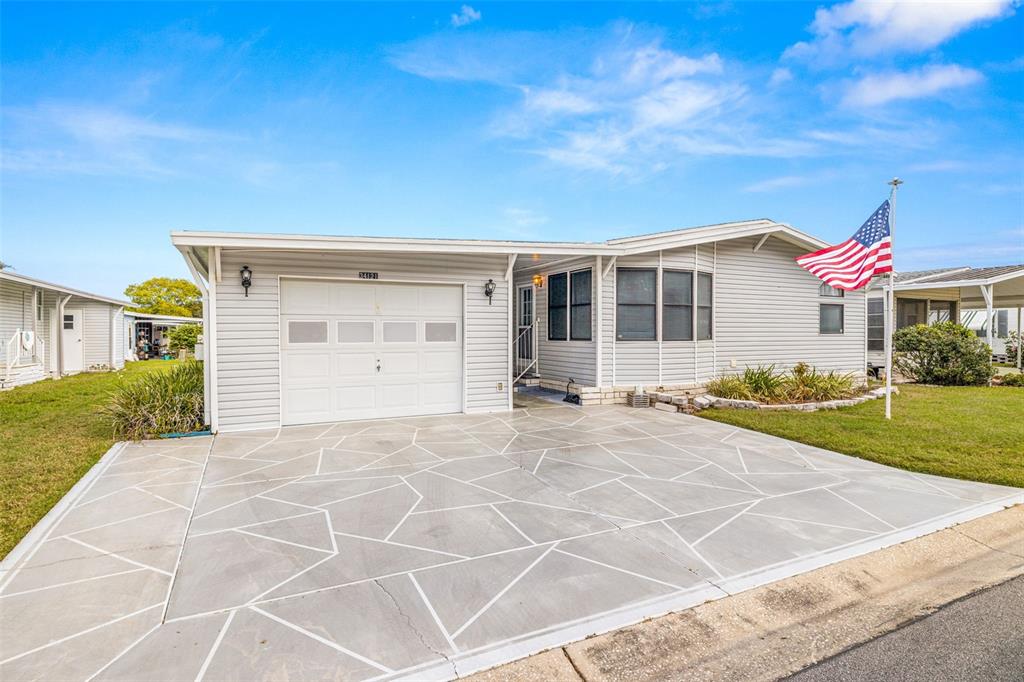 34121 Estates Lane Wesley Chapel, FL 33543 - Photo 1 of 1 Welcome home to this unique home in Timber Lake Estates! This home is a 3 bedroom / 3 bath home with a garage, parking pad for a golf cart in the rear of the home, and an enclosed lanai with A/C! Perfect for those out of town guests!