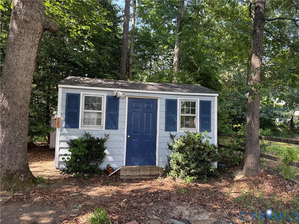 10700 Blossomwood Road Chesterfield, VA 23832 - Photo 6 of 6 Light blue exterior shed featuring a dark blue doo