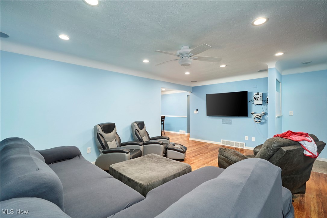1129 Homestead Road Cleveland, OH 44121 - Photo 12 of 26 Living room with light wood finished floors, recessed lighting, and a ceiling fan