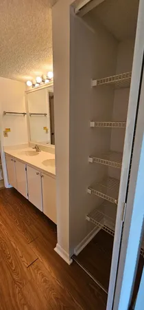 a bathroom with a mirror and a shower