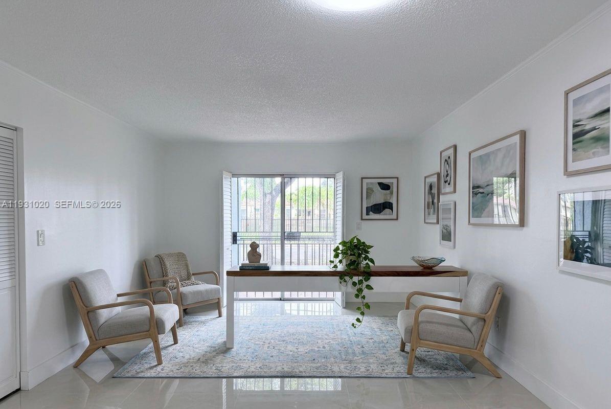 160 Southwest 30th Avenue, Unit 104A Miami, FL 33135 - Photo 1 of 32 a living room with furniture and a potted plant