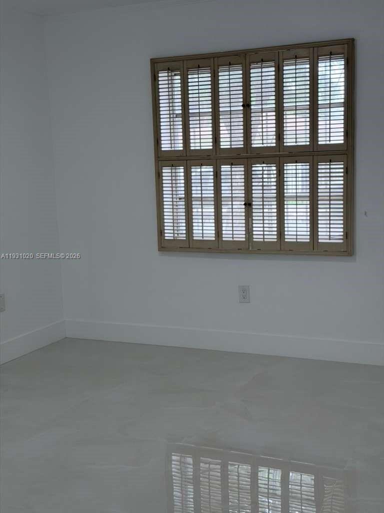 160 Southwest 30th Avenue, Unit 104A Miami, FL 33135 - Photo 18 of 32 a view of an empty room