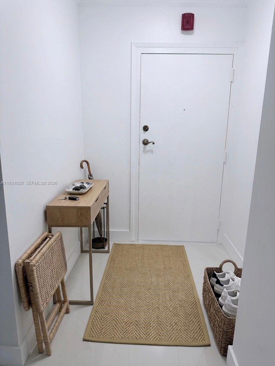 160 Southwest 30th Avenue, Unit 104A Miami, FL 33135 - Photo 2 of 32 a bathroom with a sink and a mirror