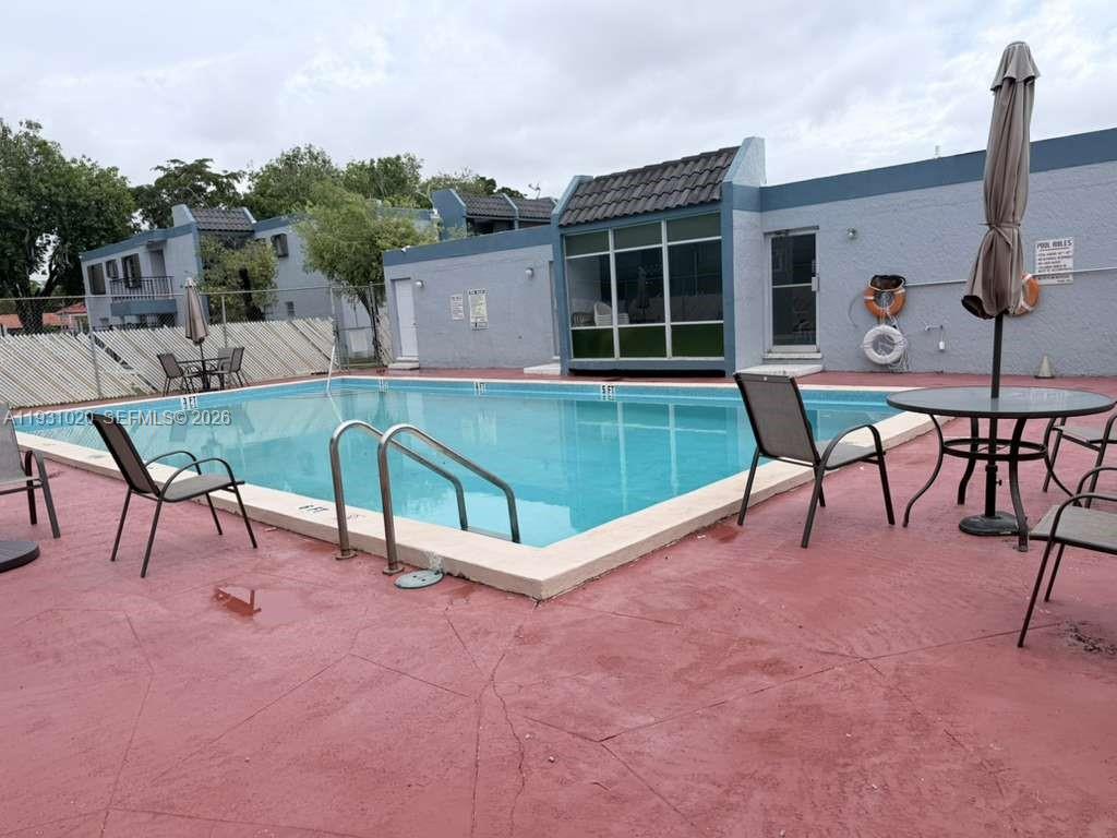 160 Southwest 30th Avenue, Unit 104A Miami, FL 33135 - Photo 30 of 32 a view of a chairs and table in the terrace