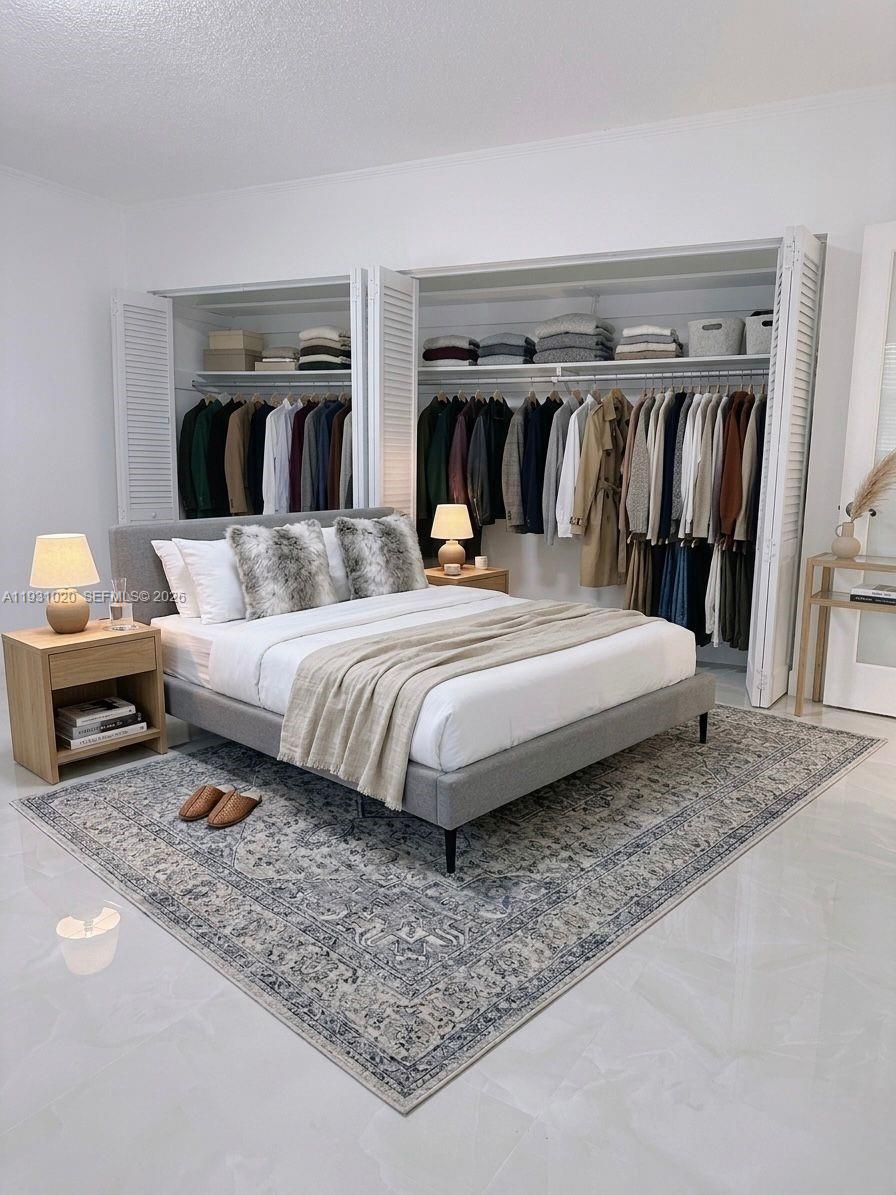 160 Southwest 30th Avenue, Unit 104A Miami, FL 33135 - Photo 6 of 32 a bedroom with a bed and a night stand