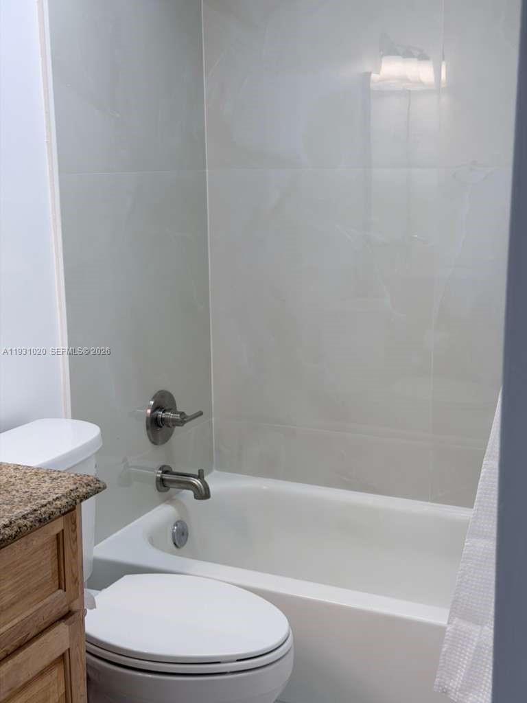 160 Southwest 30th Avenue, Unit 104A Miami, FL 33135 - Photo 8 of 32 a bathroom with a sink and a mirror