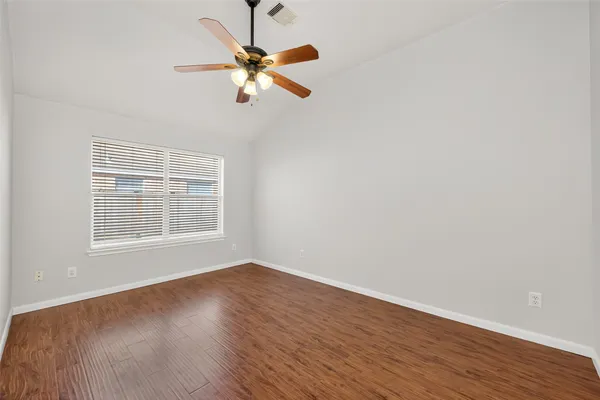 a view of a livingroom with wooden floor