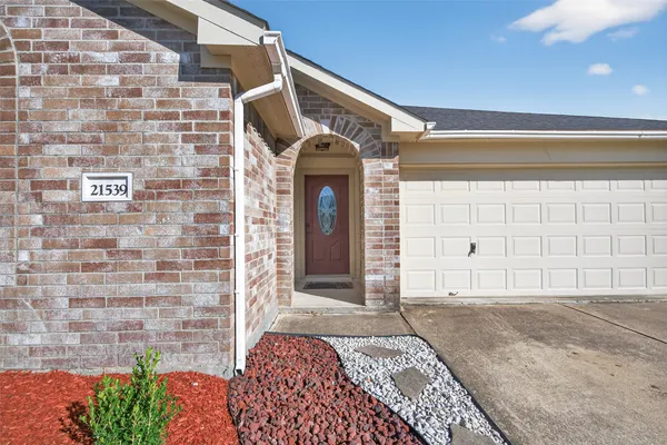 a front view of a house with a garage