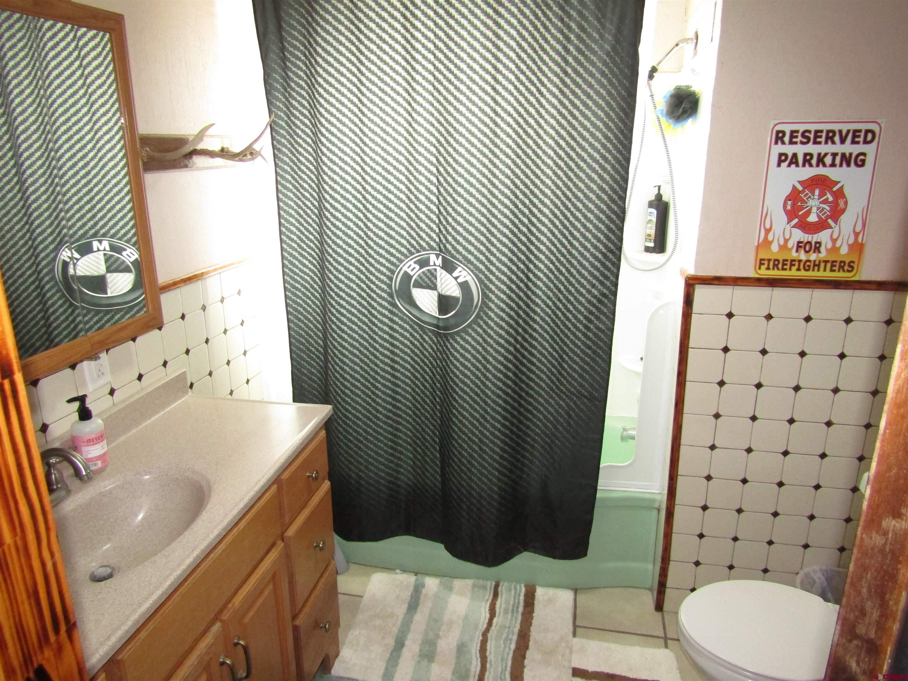 412 Lariat Road Monte Vista, CO 81144 - Photo 9 of 12 a bathroom with a sink toilet and shower