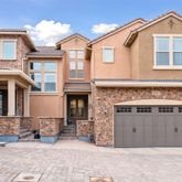 a view of a house with a yard and sitting space