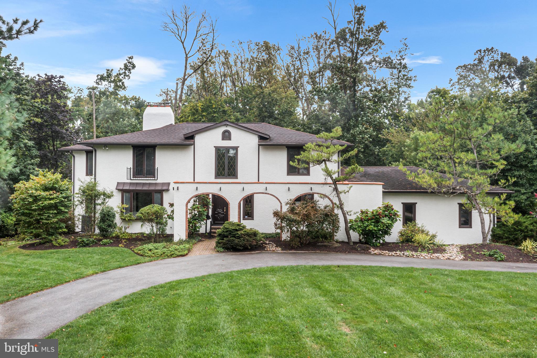 204 French Road Newtown Square, PA 19073 - Photo 1 of 36 a front view of a house with a garden