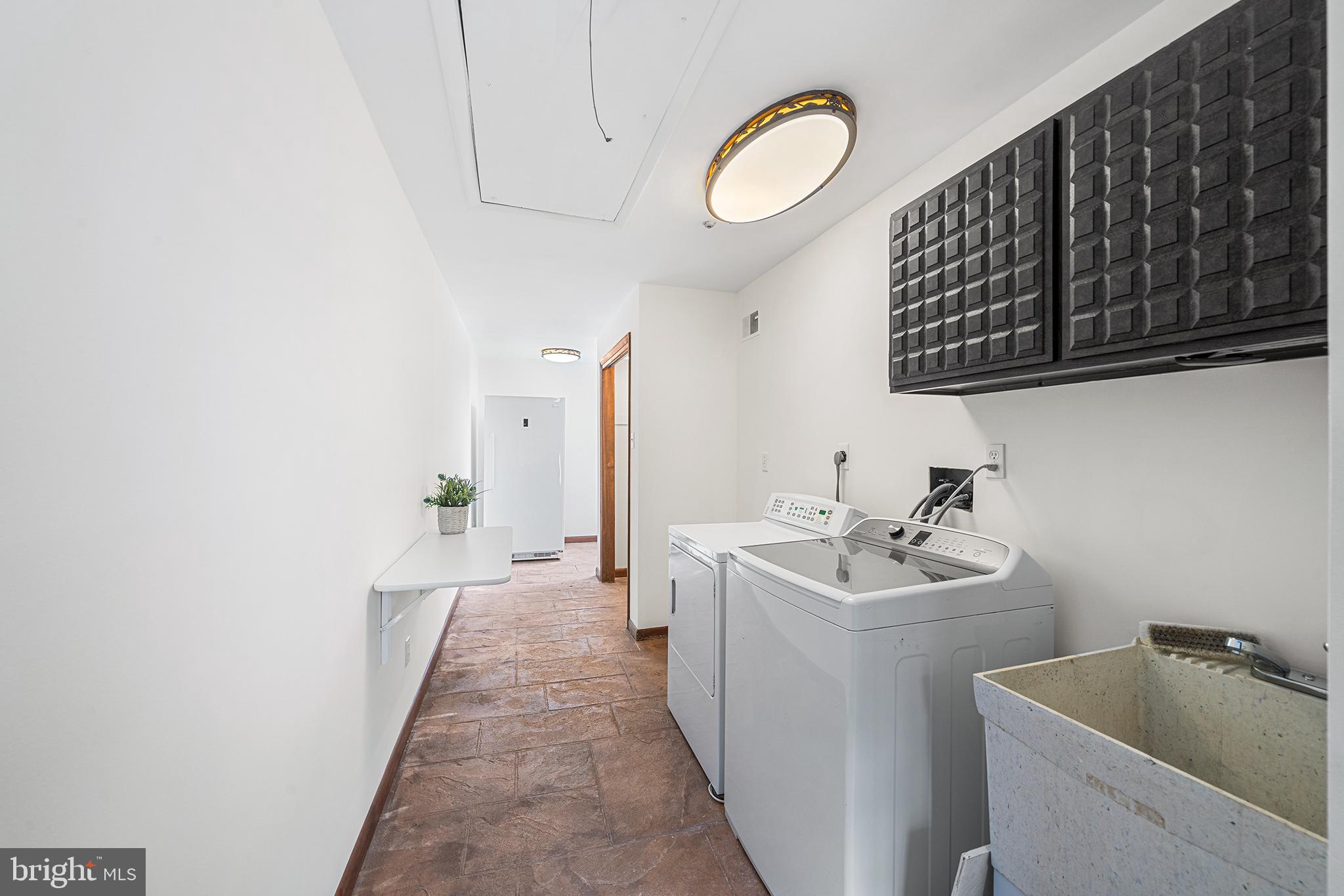 204 French Road Newtown Square, PA 19073 - Photo 12 of 36 a hallway with sink and mirror