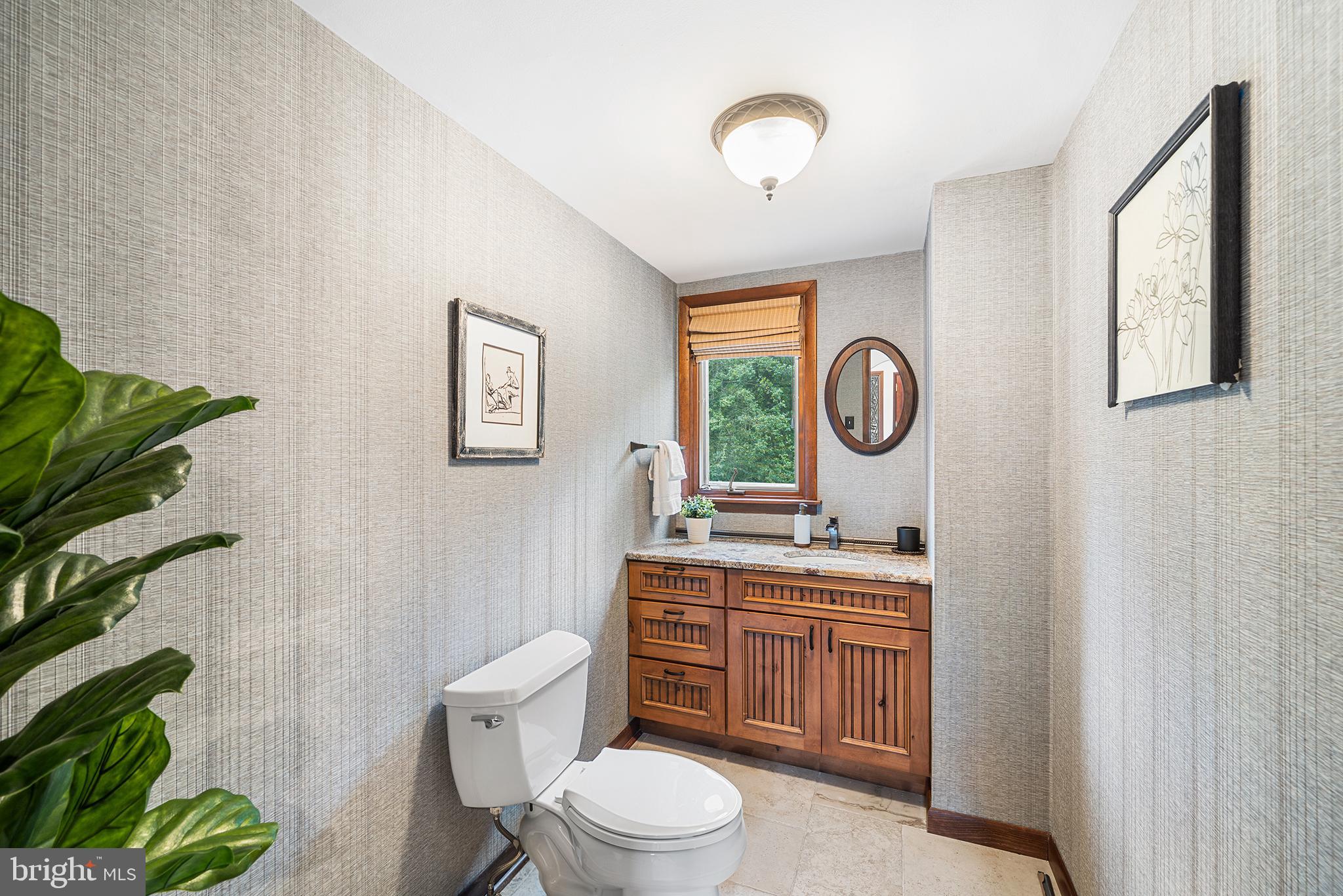 204 French Road Newtown Square, PA 19073 - Photo 14 of 36 a bathroom with a toilet a sink and a mirror