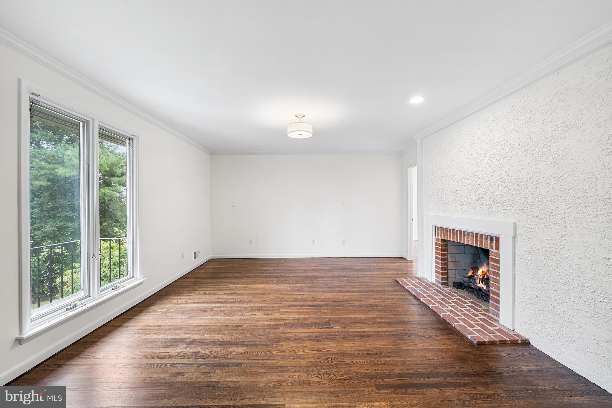 204 French Road Newtown Square, PA 19073 - Photo 17 of 36 a view of empty room with wooden floor and fireplace
