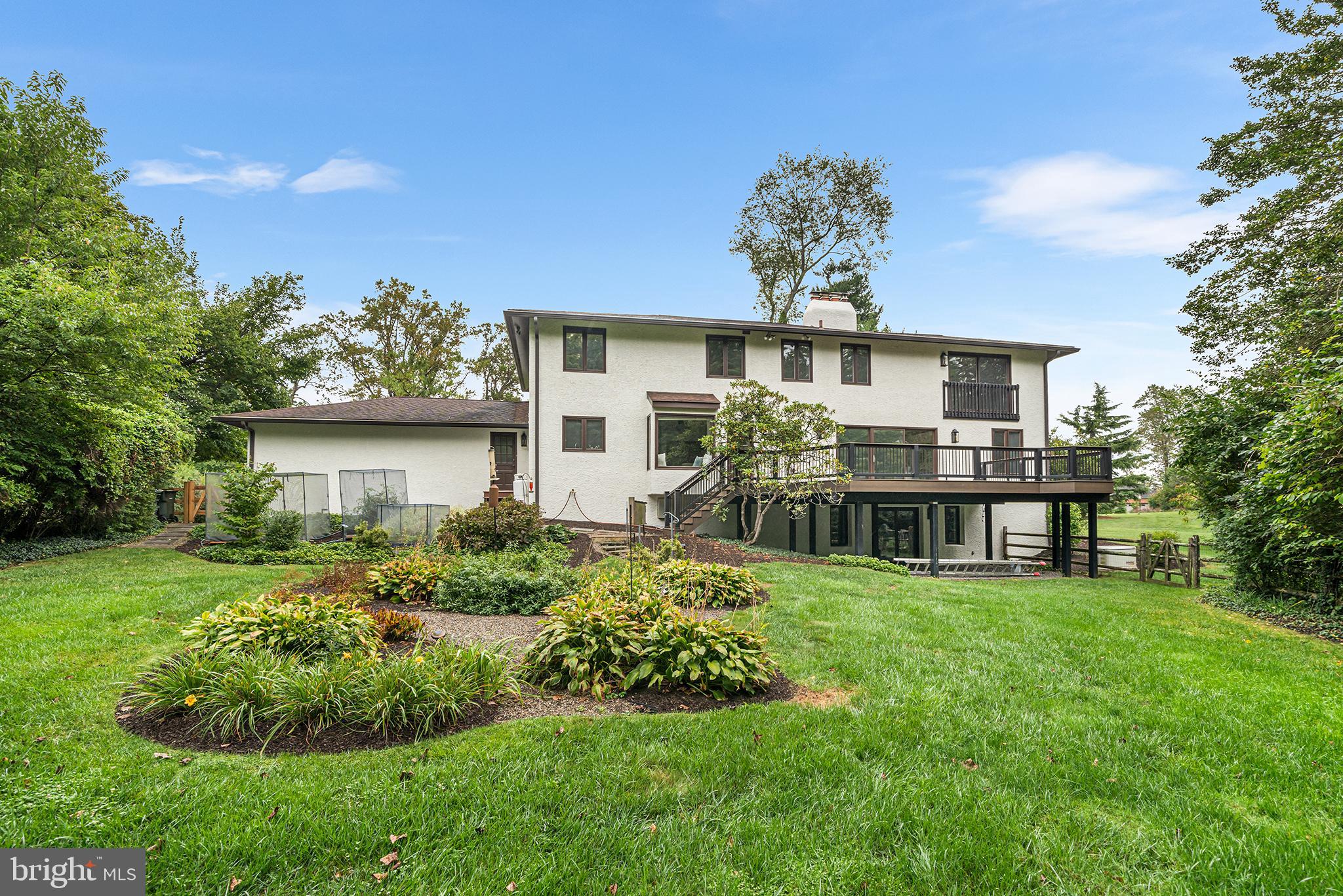 204 French Road Newtown Square, PA 19073 - Photo 30 of 36 a view of a house with a yard and a garden