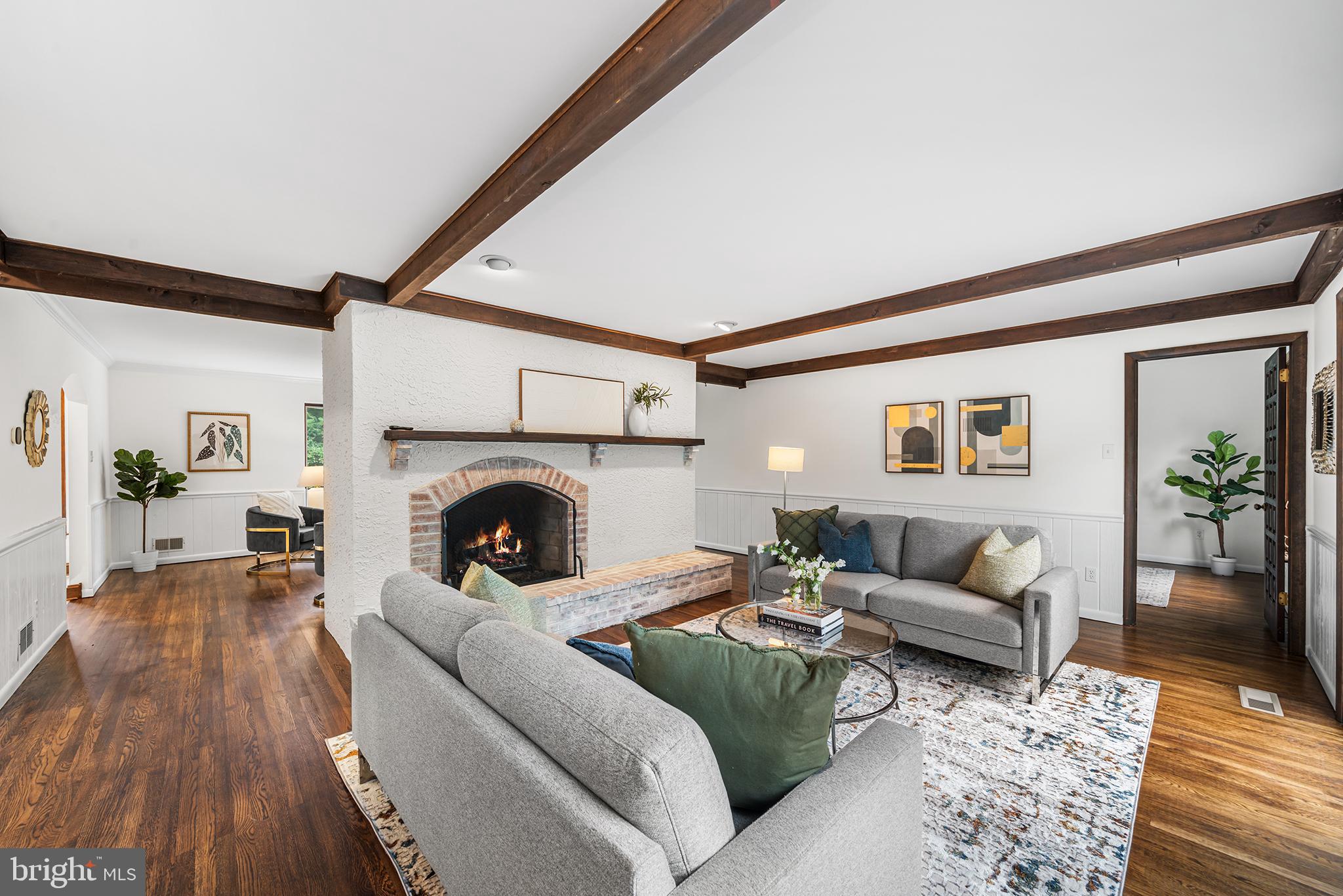 204 French Road Newtown Square, PA 19073 - Photo 6 of 36 a living room with furniture and a fireplace