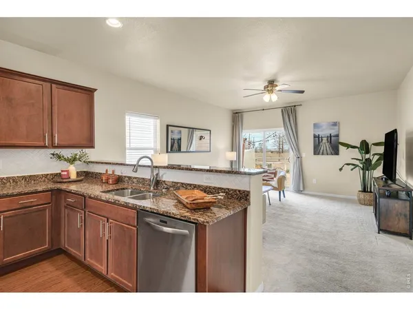 a kitchen with a sink cabinets and window