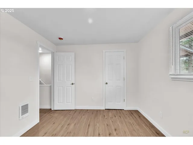 a view of an empty room and window