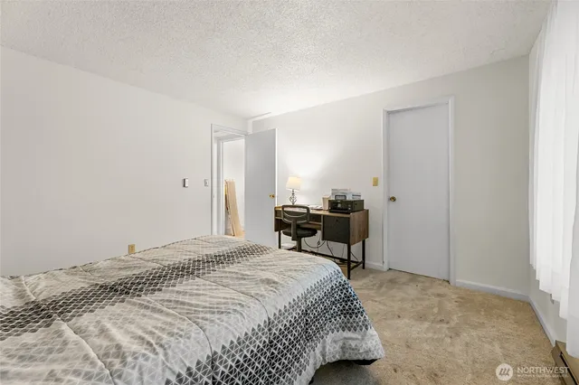 a bedroom with a bed furniture and a window