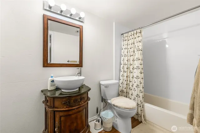 a bathroom with a toilet a sink and a bathtub