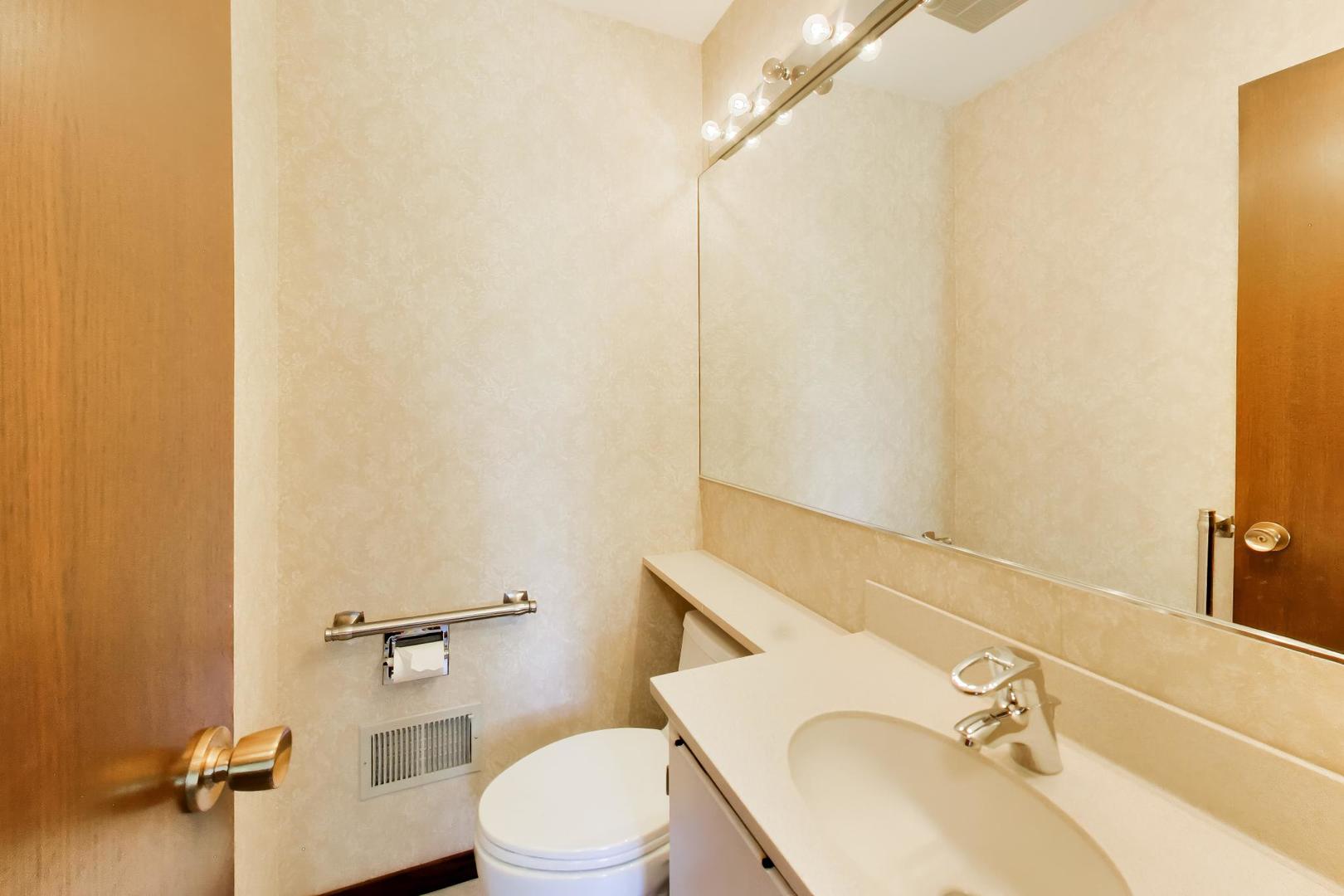 103 Cottonwood Road Northbrook, IL 60062 - Photo 20 of 50 a bathroom with a sink and a toilet