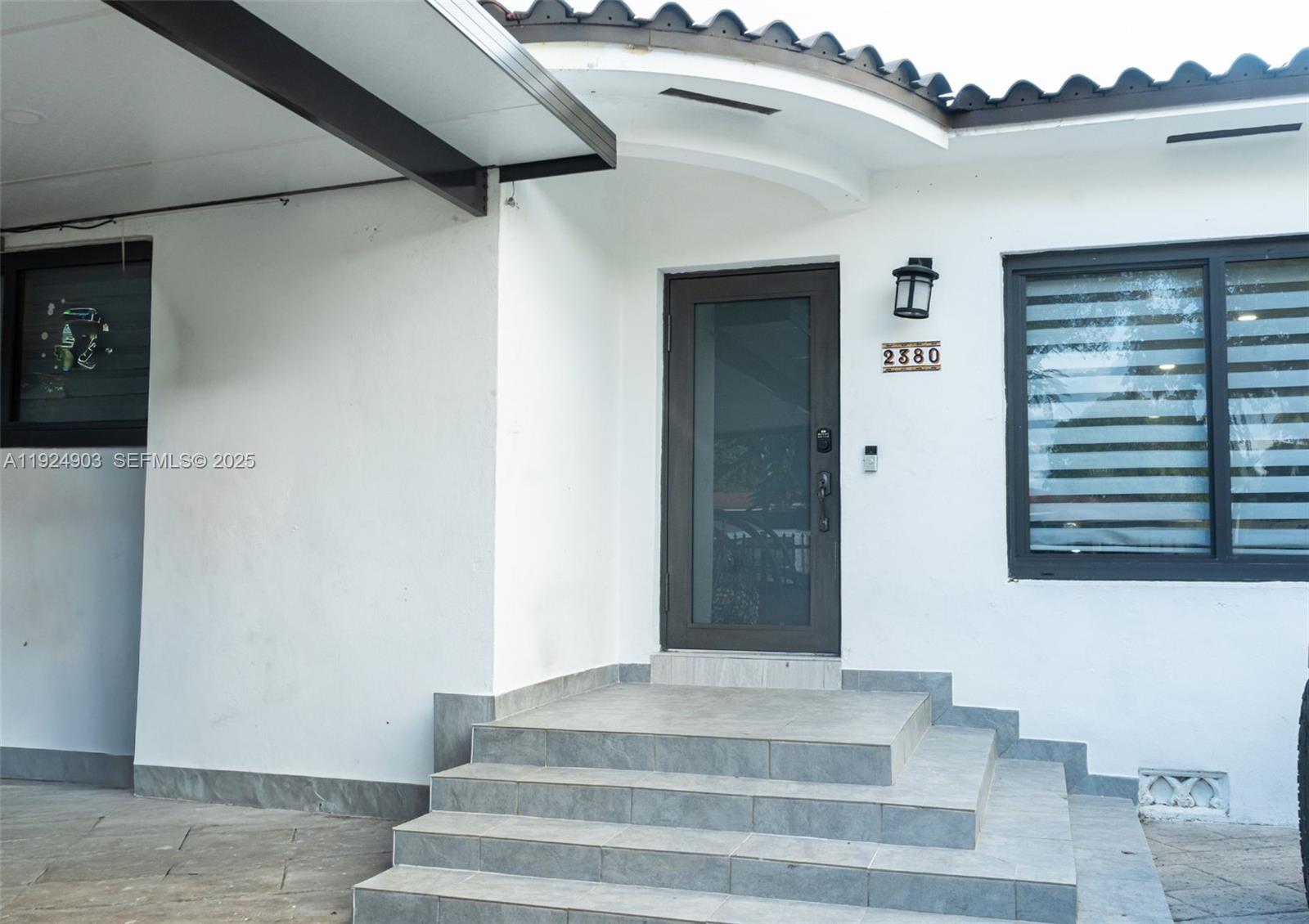 a view of staircase with white walls